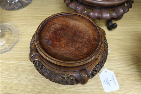 Two Chinese hardwood stands largest 20cm diameter